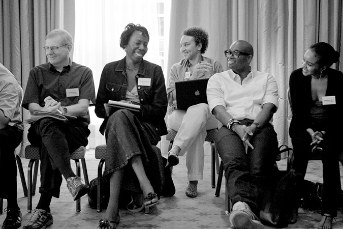 Group at leadership retreat sitting and smiling