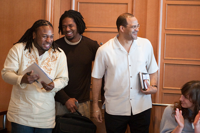 Donald Ruff, Marcus Walton and David Banks smiling as audience applauds