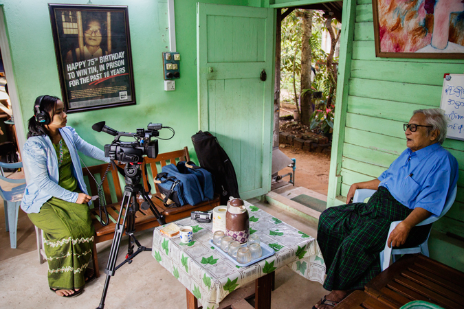 A woman interviewing a man