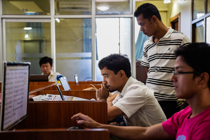A man sitting in front of a computer