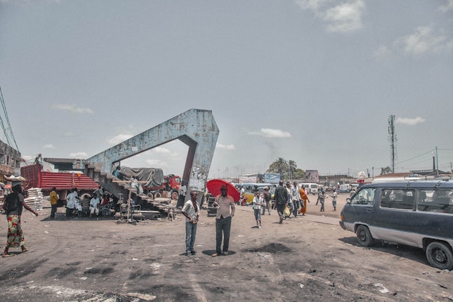 A dilapidated pedestrian bridge sits along the Boulevard Lumumba in the Tshangu District of Kinshasa in 2013. Photo credit: © Sammy Baloji An exposed staircase in an empty lot