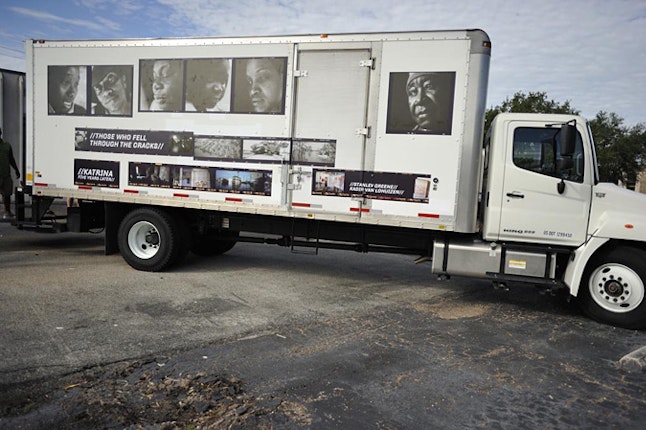 Truck with Those Who Fell Through the Cracks exhibition photographs on side