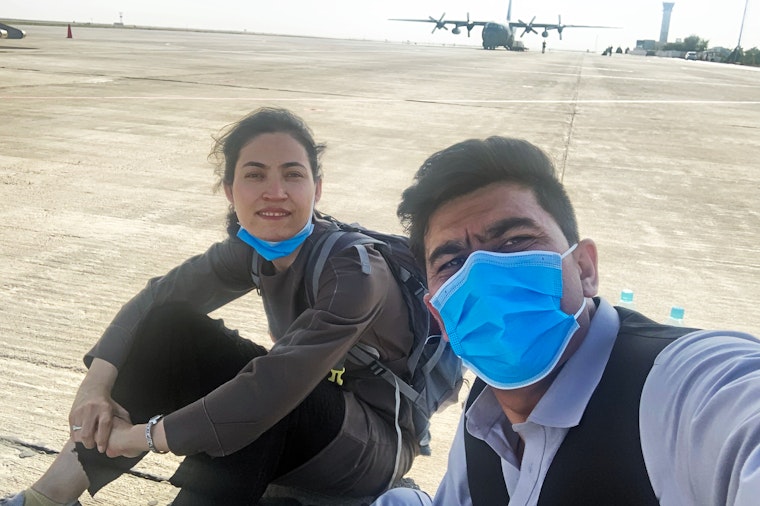 The author Gaisu Yari and her partner on the tarmac at Kabul’s airport