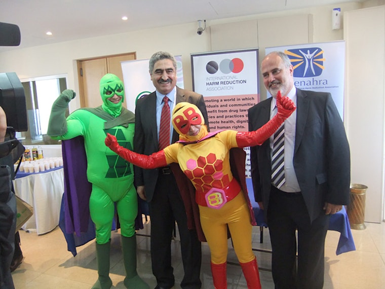 Two people wearing Buprenorphine Babe and Methadone Man costumes standing with Dr. Walid Ammar and Elie Aaraj