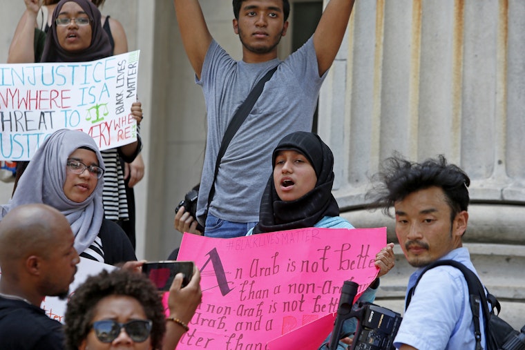 Activists demonstrate at a Black Lives Matter rally in downtown Brooklyn on July 25, 2016. Photo credit: © Andy Katz/Newscom People holding handmade signs