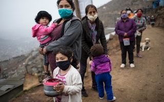 People wait in line for food in the outskirts of Lima, Peru, on June 17, 2020. Photo credit: © Rodrigo Abd/AP A group of people waiting in line outside