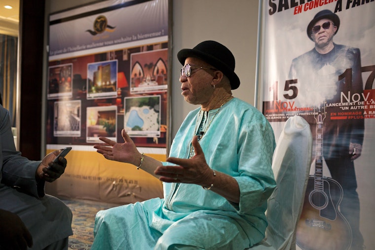 Salif Keita sits for an interview during a forum organized by his foundation to defend the rights of people with albinism in Bamako, Mali, on November 15, 2018. Photo credit: © Annie Risemberg for the Open Society Foundations Salif Keita being interviewed