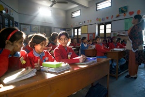 Children seated in a classroom