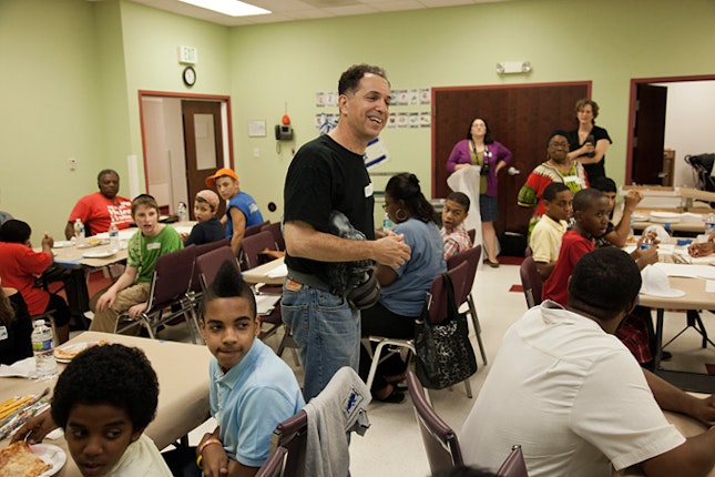 Jay Wolf Schlossberg-Cohen in a classroom with kids