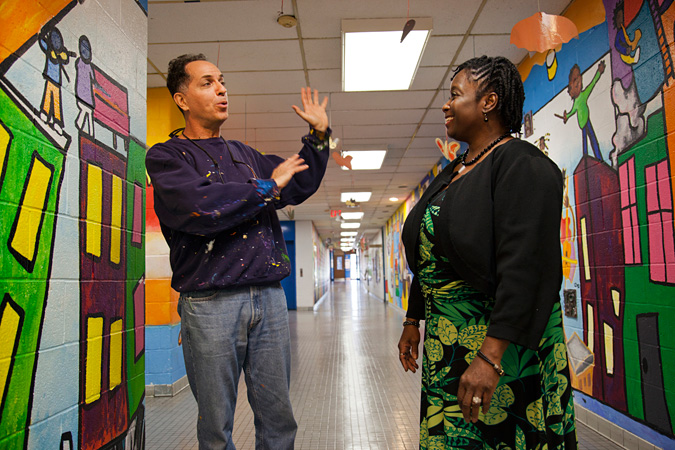 Jay Wolf Schlossberg-Cohen talking to Cynthia Cunningham Evans in hallway