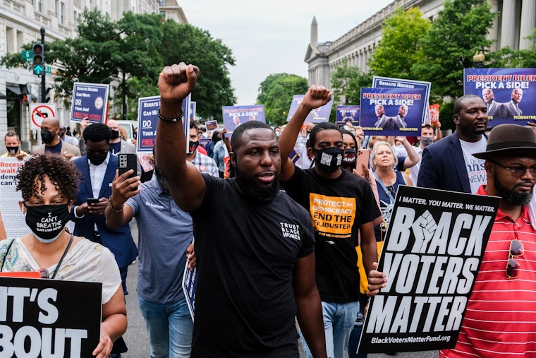 A group of protestors marching in the street