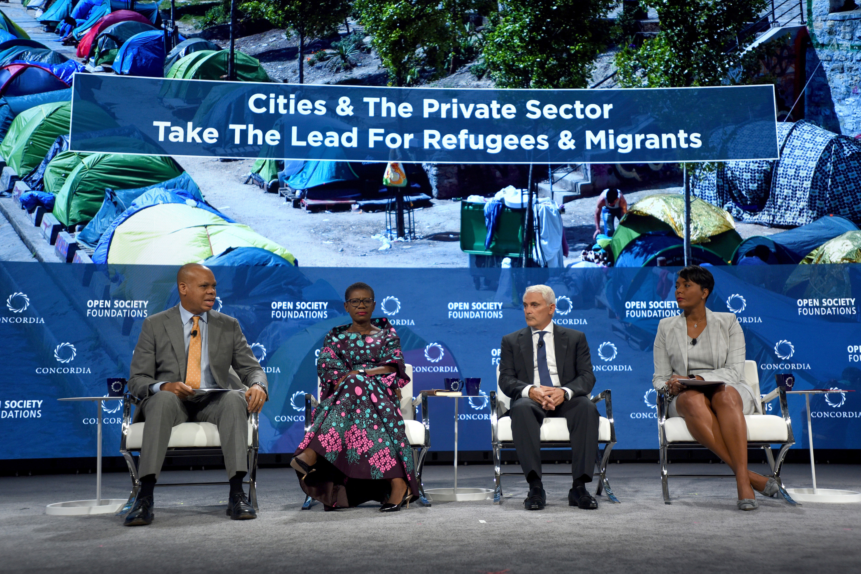 Four people on a stage.