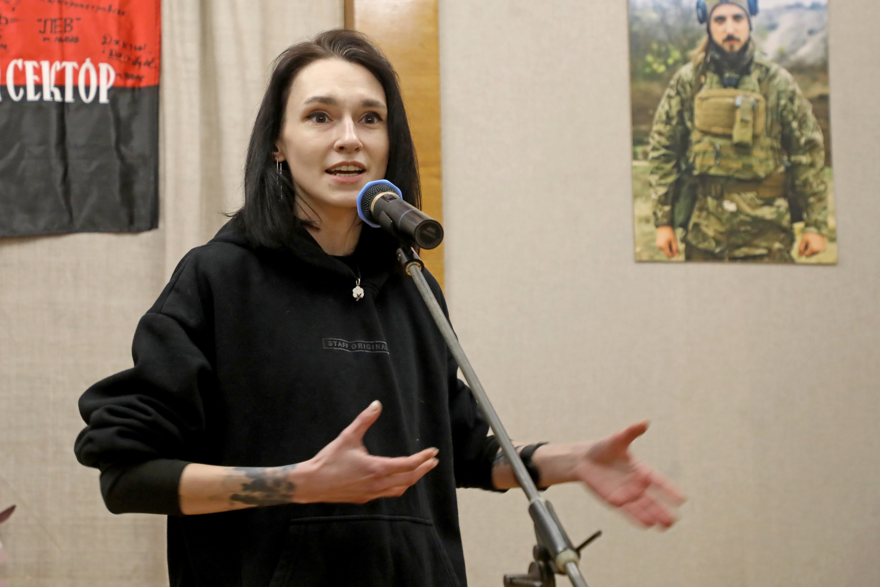 A woman speaks into a microphone