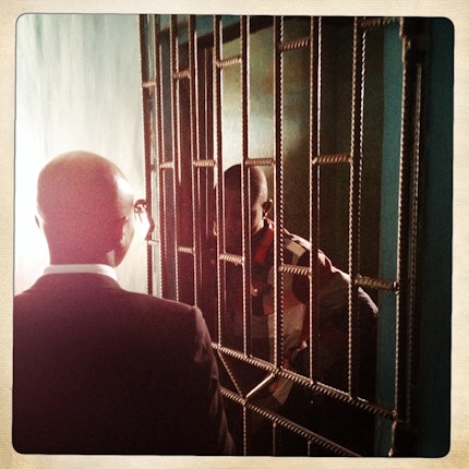 A lawyer speaks with a detainee
