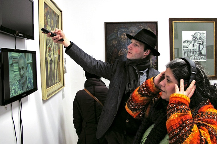 Visitors take part in an exhibition at Gallery8 in Budapest, a space for Romani contemporary art, in February 2013. Photo credit: © Nihad Nino Pusija Visitors at an art gallery