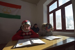 children in a classroom reading