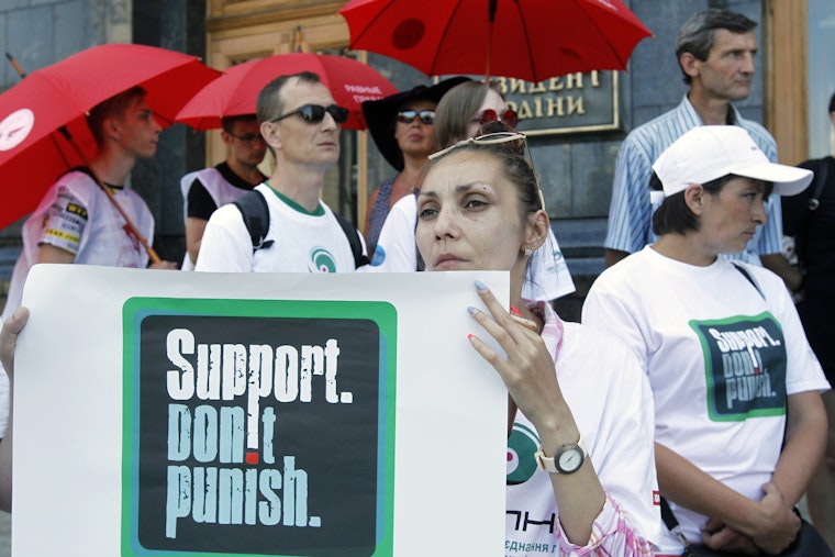 Ukrainians take part in a rally against repressive drug policies in Kiev, Ukraine, on June 26, 2019. Photo credit: © Pavlo Gonchar/SOPA/Newscom People wearing T-shirts and holding signs that state 'Support. Don't Punish'