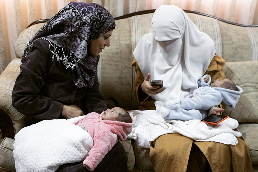 Two mothers with their babies