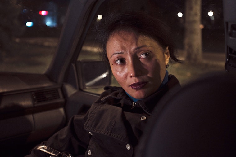 A sex worker in Bishkek, Kyrgyzstan, speaks with a peer outreach worker in September 2012 after being kidnapped and raped by police. Photo credit: © Ruben Salvadori/Contrasto/Redux Woman in a car