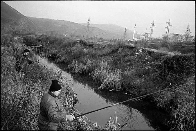 Two men fishing in a river