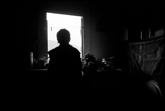 Mother and child in a dark room