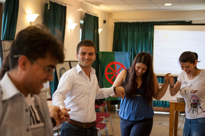 Barvalipe participants holding hands and dancing.