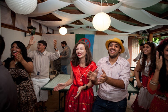 Participants celebrating after playing their evening performance Roma Congress. Barvalipe is an opportunity to build close ties between Roma activists and future leaders. “I really felt myself like I was with my family,” one participant summed up. Photo credit:© Bjoern Steinz/Panos Pictures for the Open Society Foundations Barvalipe participants dancing and clapping.