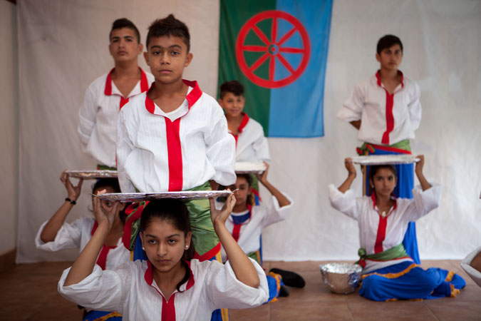 Roma children performing a play.