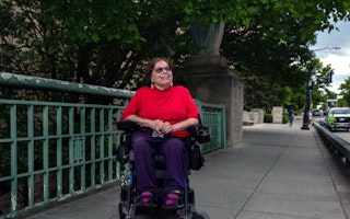 Disability rights advocate Judith Heumann poses for a photo in Washington, D.C., on May 11, 2021. © Shuran Huang/Washington Post/Getty Judith Heumann sitting in a wheelchair on a bridge