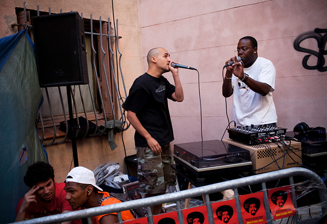 Tow men singing into microphones