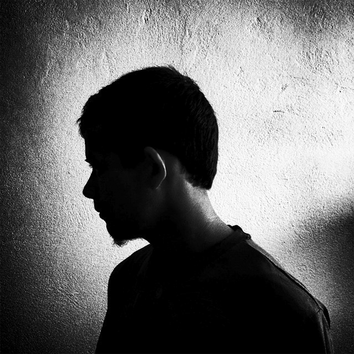 Immigrant conceals his face