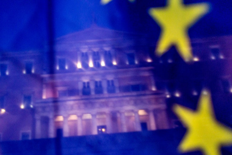 Greek Parliament seen behind an EU flag