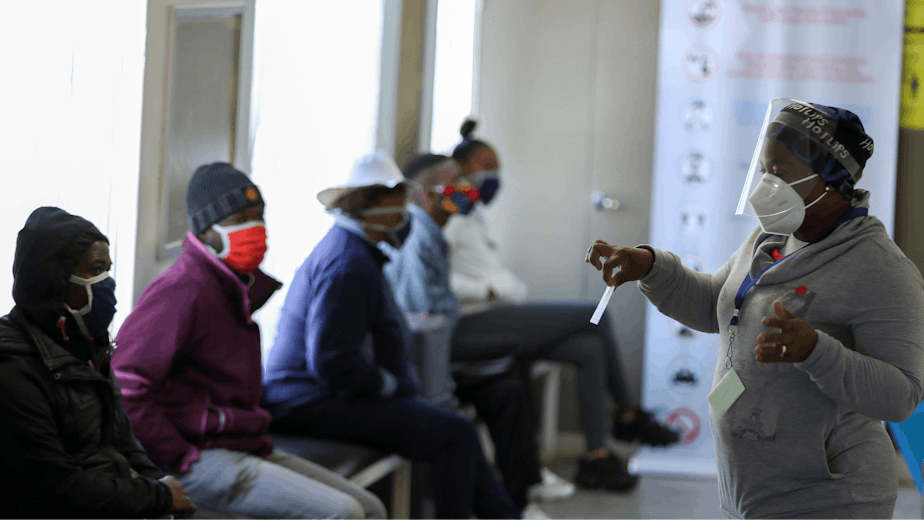 A medical worker speaks to volunteers as they wait to receive a potential COVID-19 vaccine during clinical trials in Soweto, South Africa, on June 24, 2020. Photo credit: © Siphiwe Sibeko/Reuters/Newscom A medical worker speaks to volunteers as they wait to receive a potential COVID-19 vaccine during clinical trials in Soweto, South Africa, on June 24, 2020.