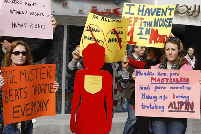 Lebanese citizens protest against the abuse of migrant domestic workers on the occasion of International Women’s Day in Beirut on March 8, 2009. Nearly 100 years old, International Women’s Day on March 8 marks an ongoing battle to ensure equal rights for half the globe’s population on issues such as work and voting. Photo credit: © Ramzi Haidar/AFP/ Getty Images A rally