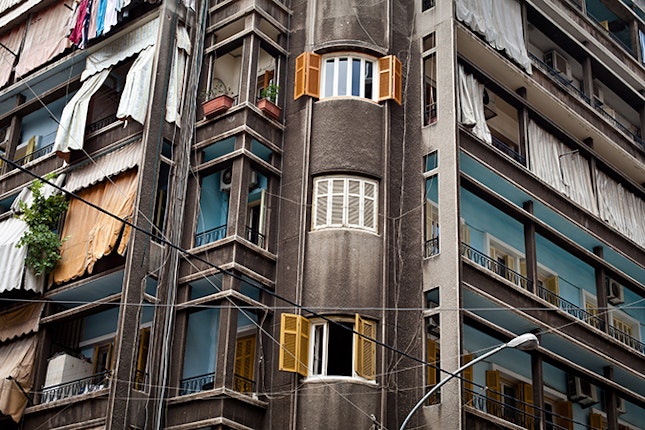 Often balconies are the only form of communication that migrant women have with the outside world. Apartments in the neighborhood of Mar Mikhael, Beirut, Lebanon, 2011. Photo credit: © Lucas Pernin Balconies on an apartment building in Lebanon