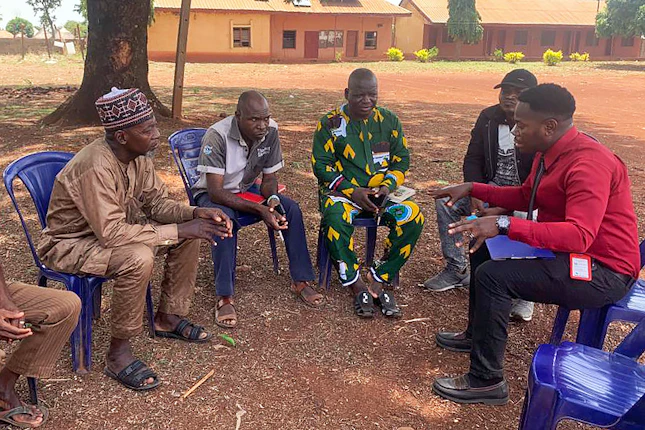 A community policing committee meets with religious leaders in Gbajimba, Guma Local Government Area, Benue State on August 21, 2024. Photo courtesy of Lawyers Alert A group of six men sit in a semicircle
