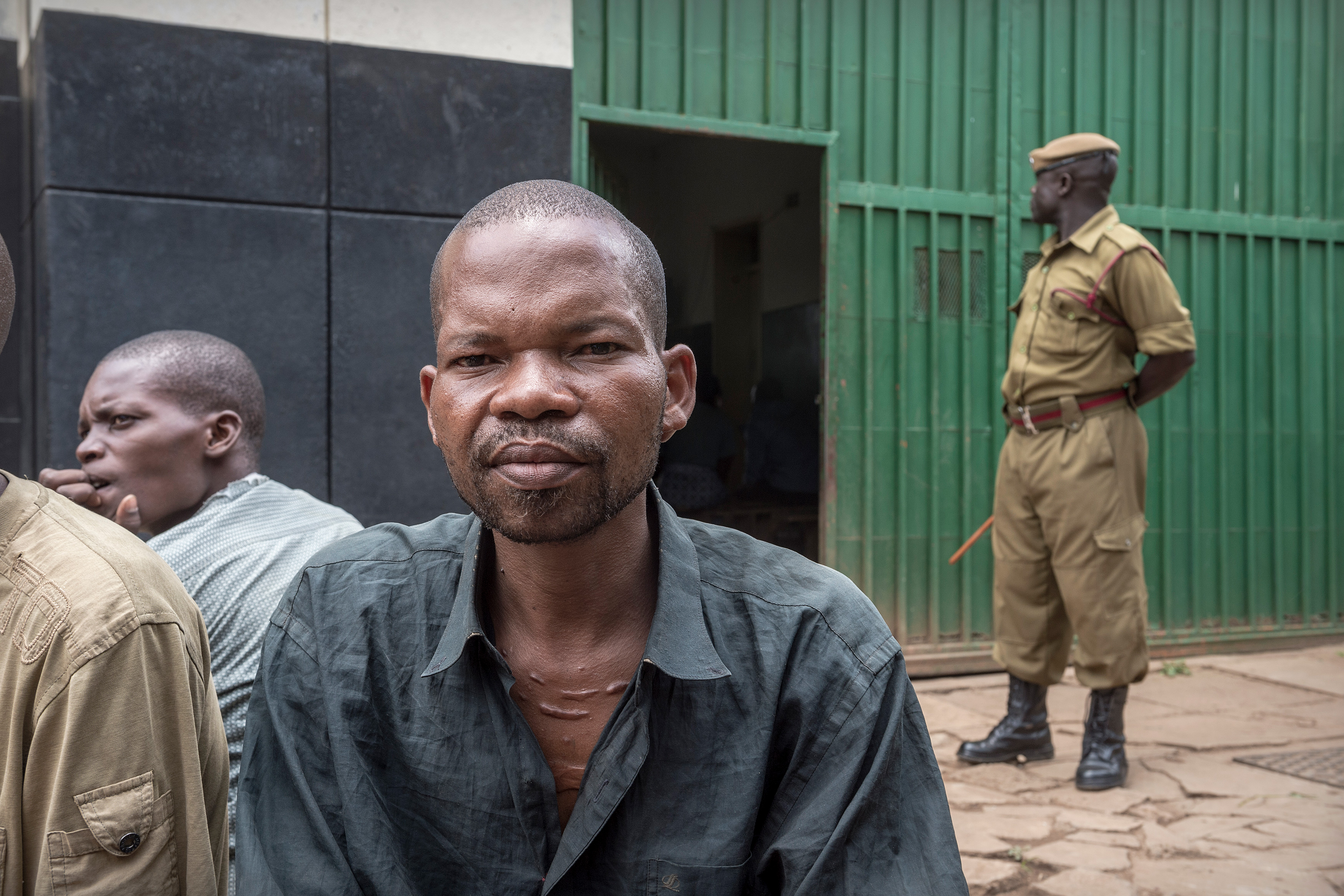 A man sitting in a prison yard