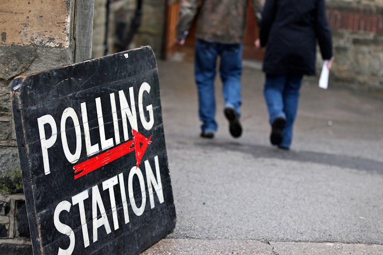 Voters enter a polling station