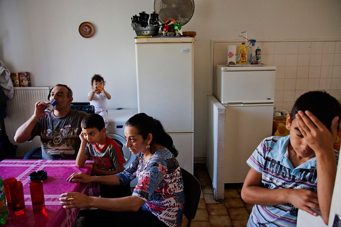 A family in a kitchen