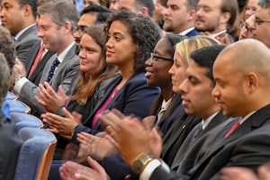 An audience of foreign service members listen to U.S. Secretary of State Mike Pompeo speak in Washington, D.C., on August 17, 2018. Photo credit: U.S. State Department/Ron Przysucha/Public Domain People in an audience clapping