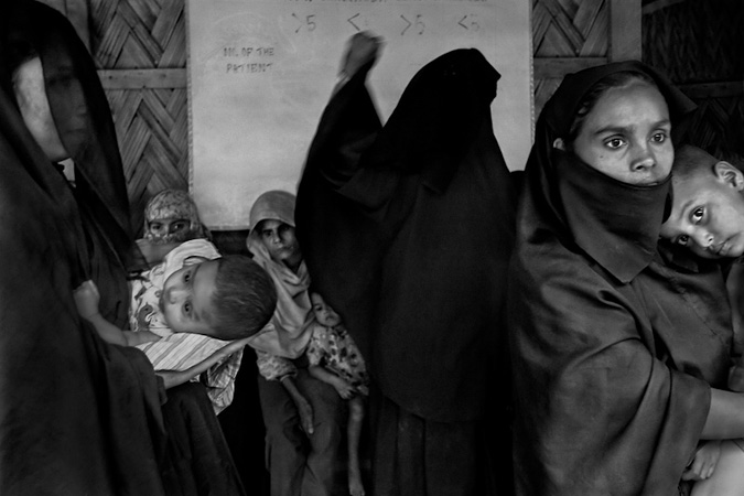 Women holding children