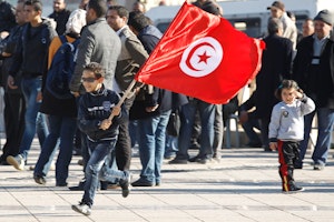 Boy with a Tunisian flag