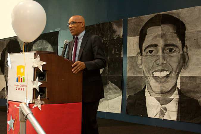 George Khaldun speaking at a podium.