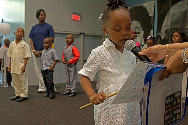 Young girl with a microphone.