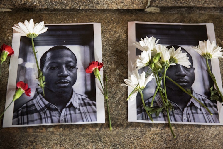 Flowers on portraits of Kalief Browder