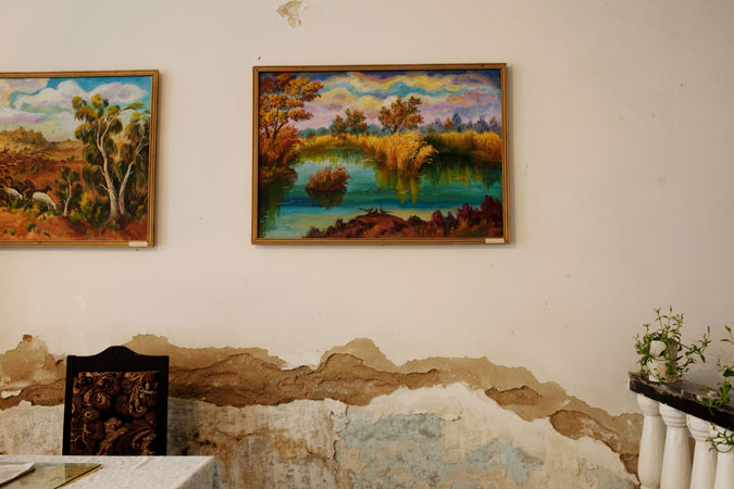 Paintings hanging on the wall.