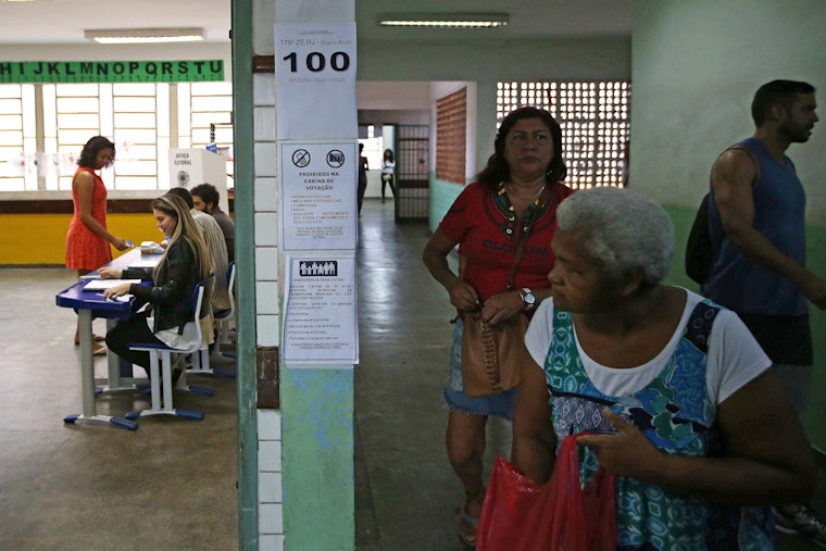 People in a polling station
