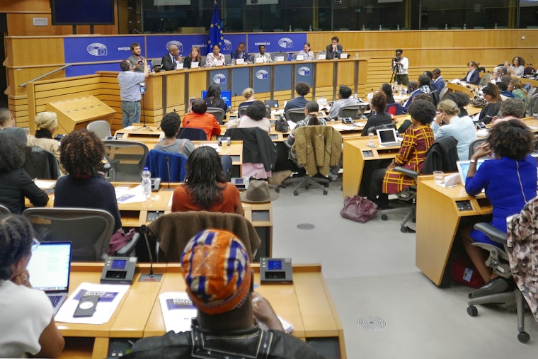 Attendees and speakers at the opening day of the EU’s People of African Descent Week, in Brussels, Belgium, on May 14, 2018. Photo credit: Alfiaz Vaiya/ARDI People in a meeting room