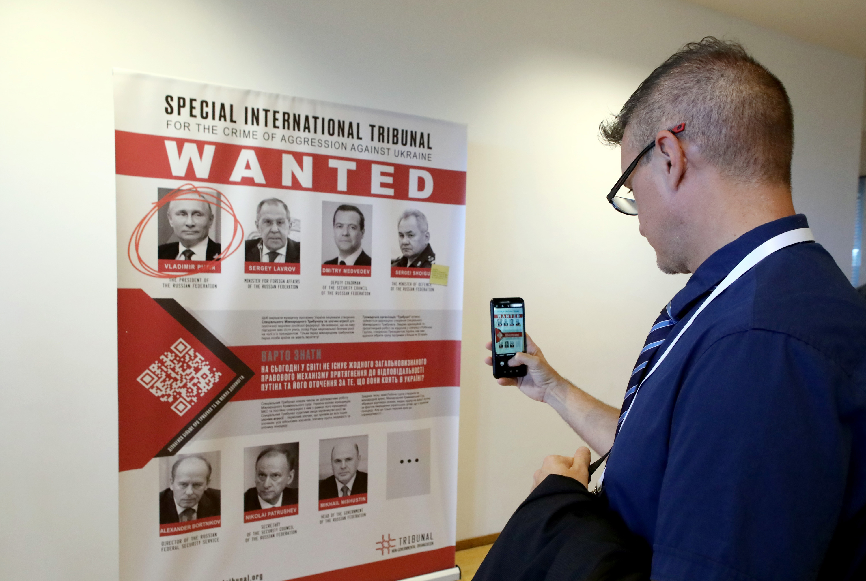 A poster with photos of government officials as part of the Special Tribunal for the Crime of Aggression against Ukraine