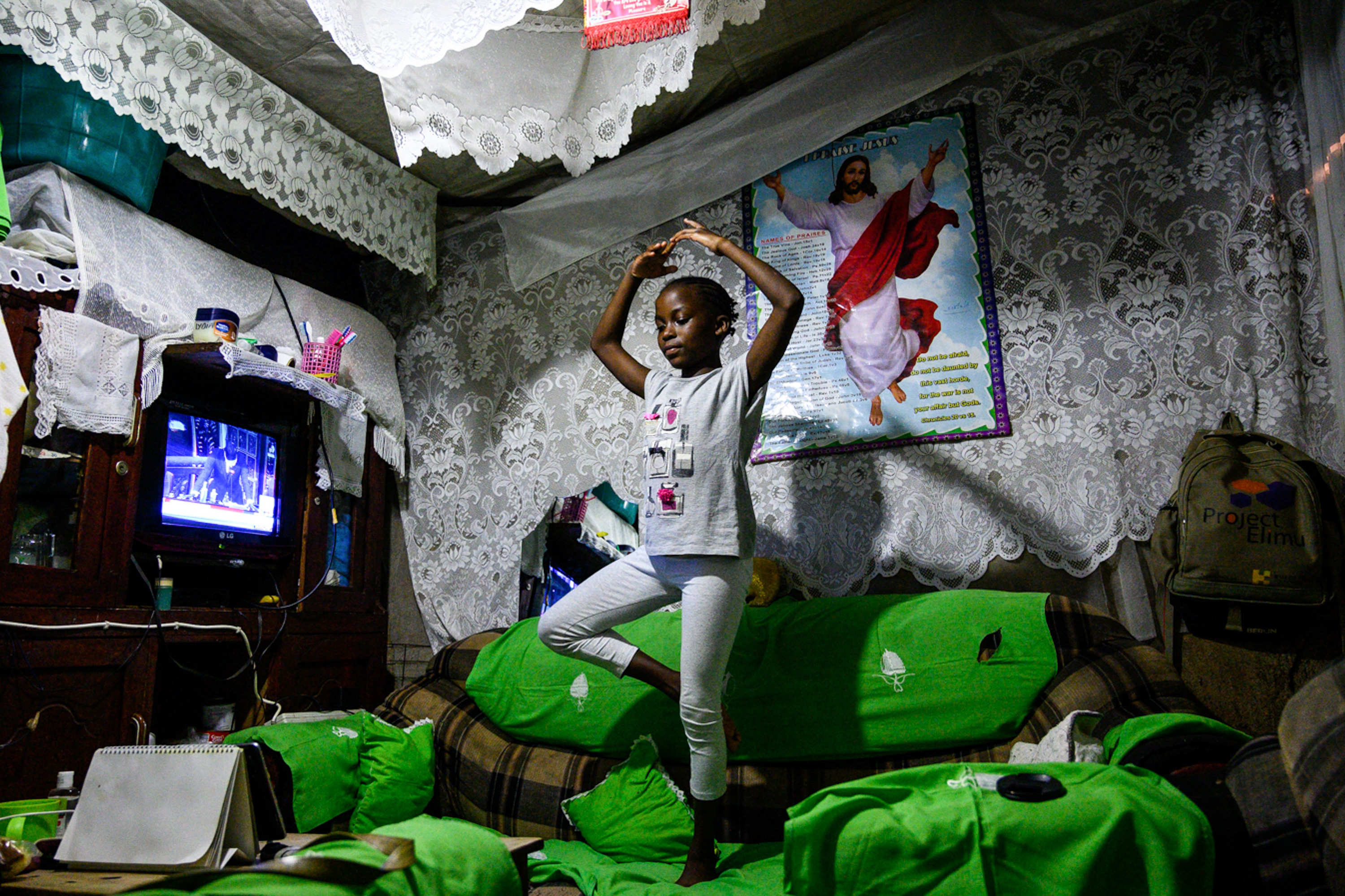 A young student participates in an online ballet class